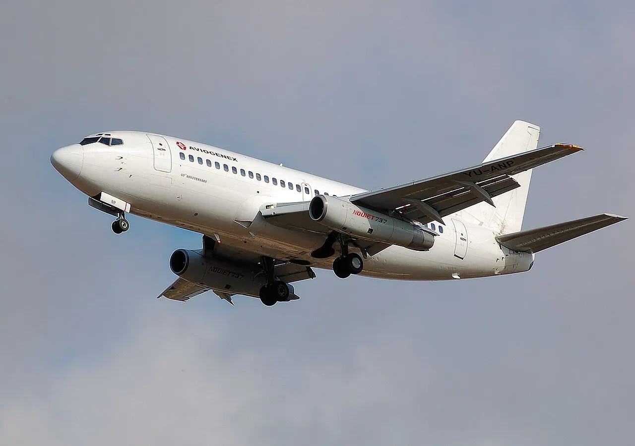 An Aviogenex Boeing 737-200, an early member of the 737 family, landing at London Heathrow Airport.