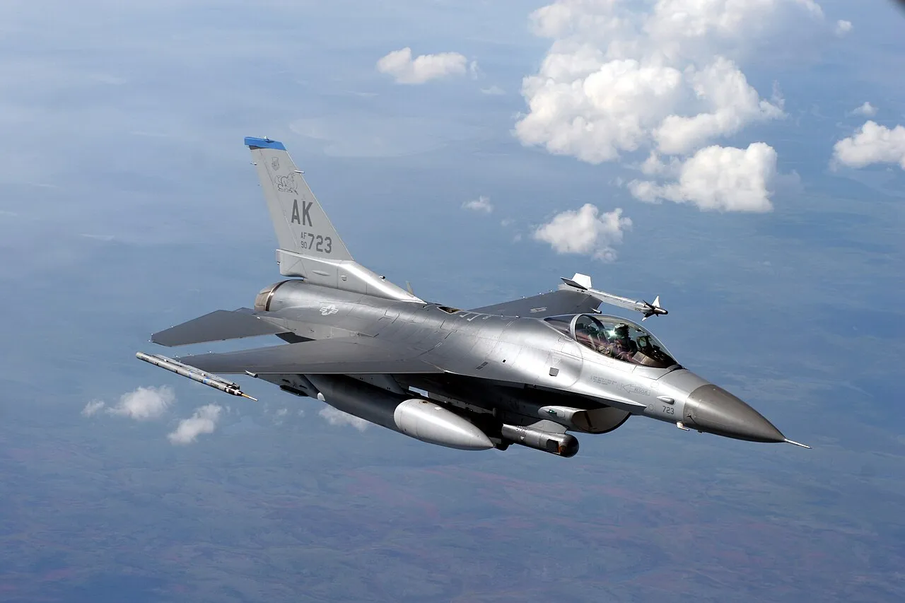 A U.S. Air Force F-16 Fighting Falcon flying behind a KC-135 tanker during an exercise over Alaska.