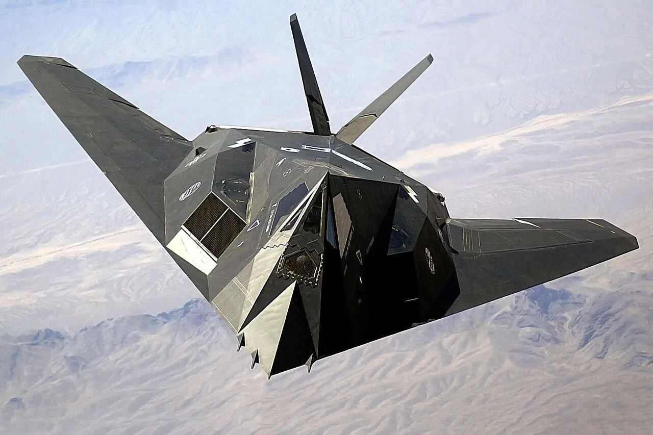 A US Air Force F-117A Nighthawk stealth aircraft in flight over Nellis Air Force Base, Nevada.