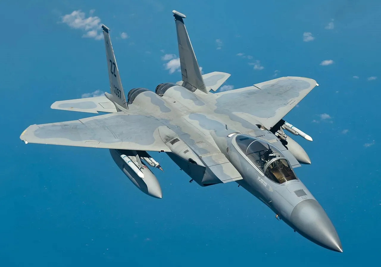 An F-15C Eagle of the 44th Fighter Squadron banking against a clear sky during a training flight.