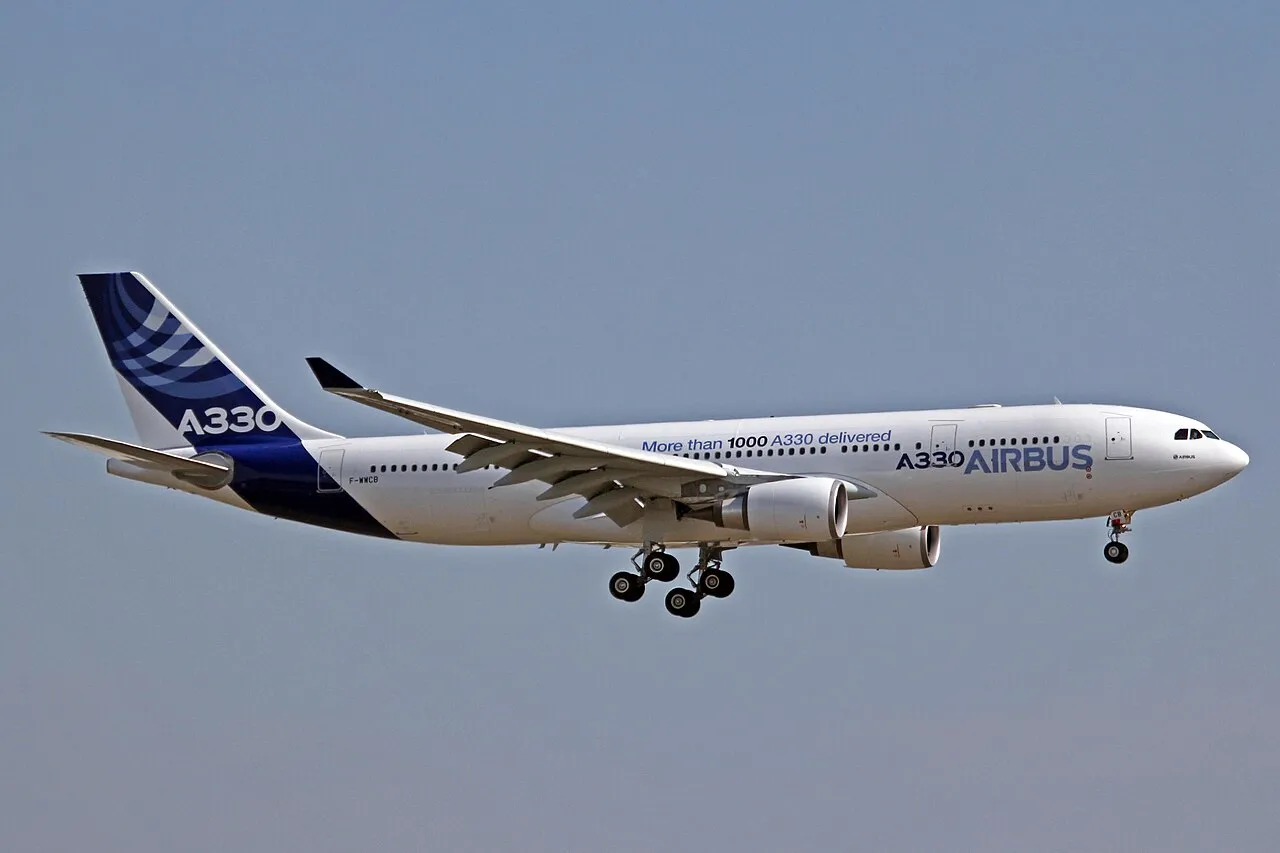 An Airbus A330-203 in Airbus Industrie house livery parked at Toulouse airport.
