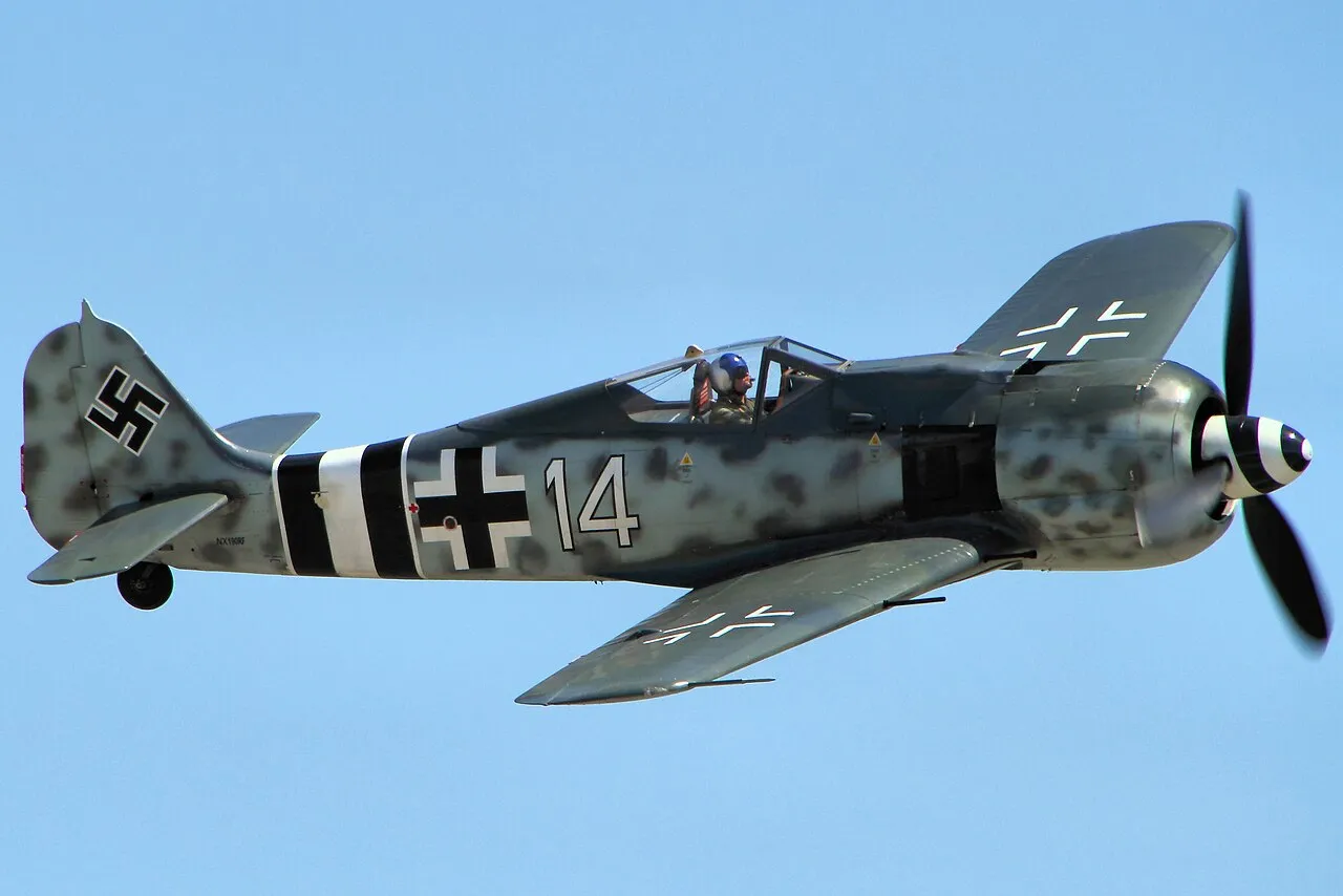 A restored Focke-Wulf Fw 190 fighter with its radial engine and wide-track landing gear, photographed at the Chino Airshow.
