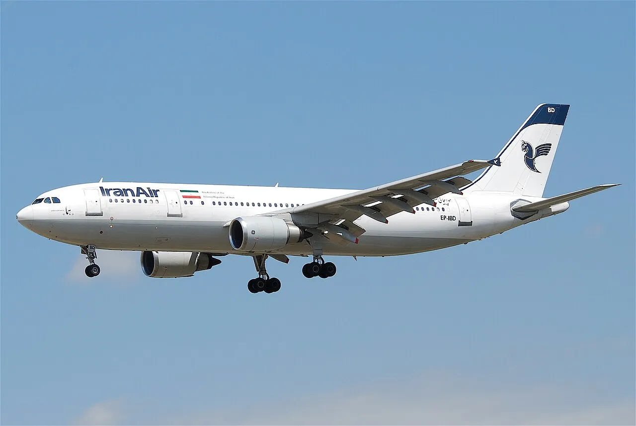 An Iran Air Airbus A300-605R on final approach, its twin underwing engines and T-tail visible against the sky.