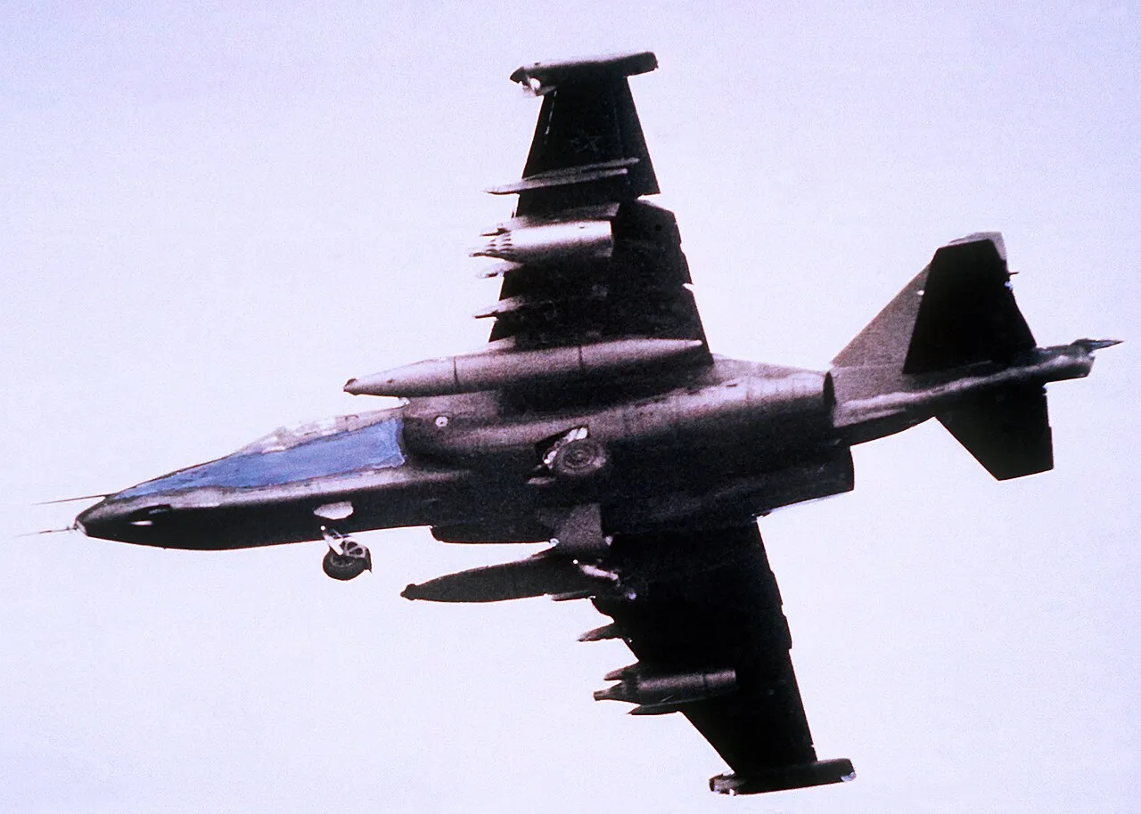 A left underside view of a Soviet-built Su-25 Frogfoot ground-attack jet in flight.