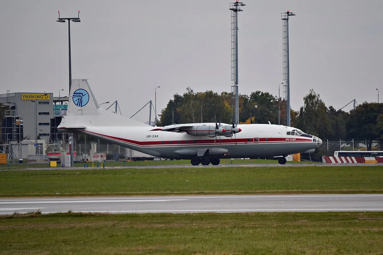 An Antonov An-12 four-engine turboprop cargo aircraft of Ukraine Air Alliance on the apron at Prague airport.
