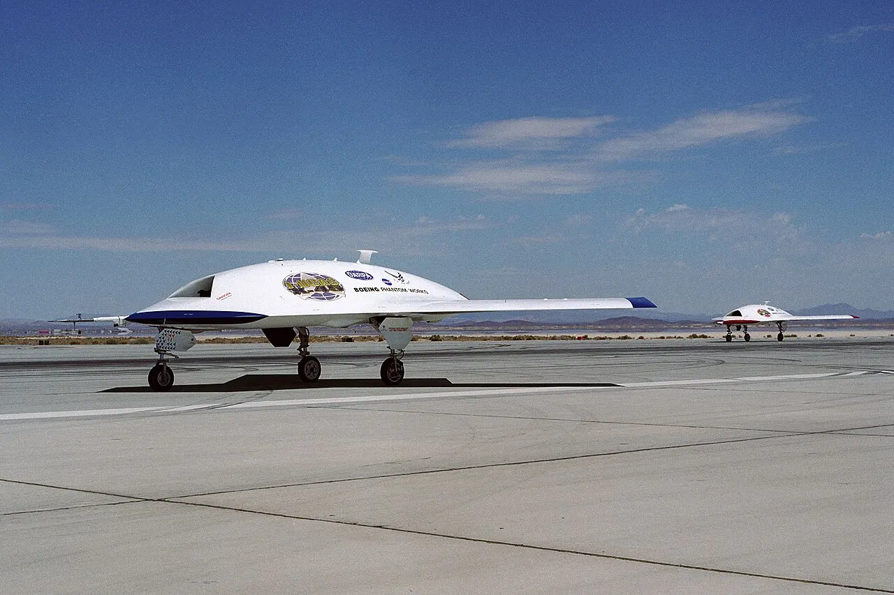 Two Boeing X-45A unmanned combat air vehicle demonstrators taxi together at Edwards Air Force Base, California.