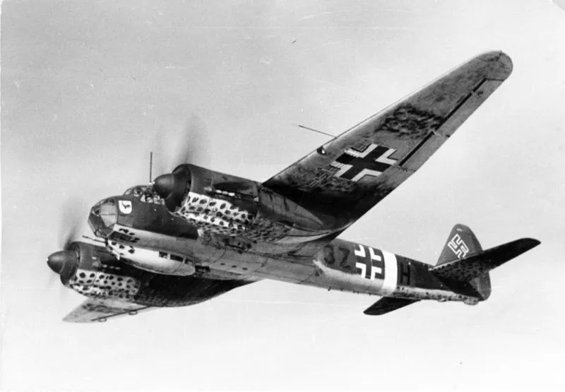 A Junkers Ju 88 A-4 twin-engine bomber in flight, showing its spotted camouflage underside and fuselage code 3Z+HH.