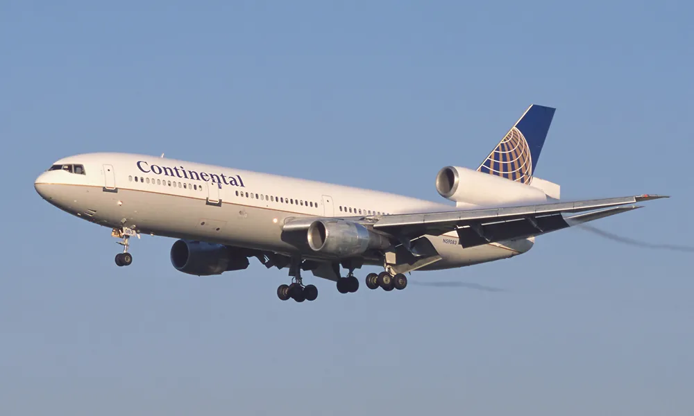 A Continental Airlines McDonnell Douglas DC-10-30 photographed from the side on an airport apron.