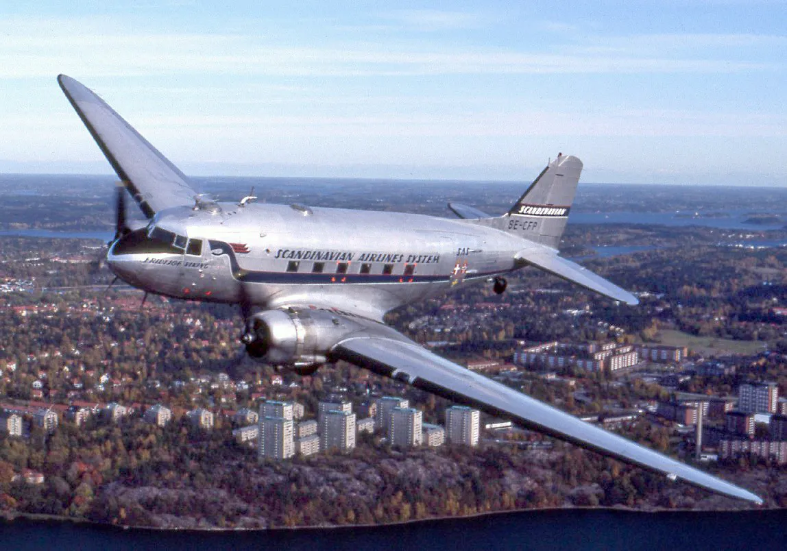 A Douglas DC-3 with Swedish registration SE-CFP in flight over Stockholm.