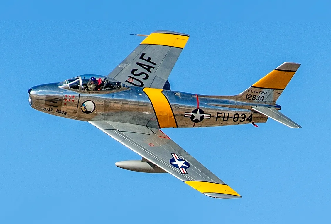 A preserved North American F-86 Sabre in flight during a USAF Heritage Flight training course.