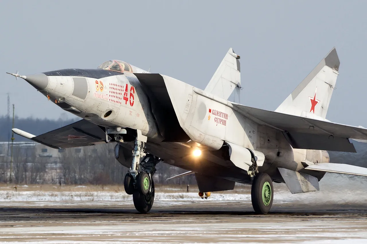 A Russian Air Force Mikoyan-Gurevich MiG-25RB reconnaissance-bomber on the ground, showing its large twin-finned tail and long nose.