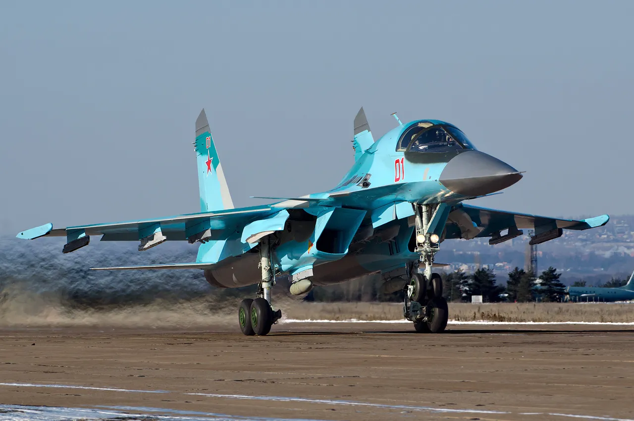 A Russian Air Force Sukhoi Su-34 strike fighter in flight, showing its side-by-side twin cockpit and duck-bill nose.