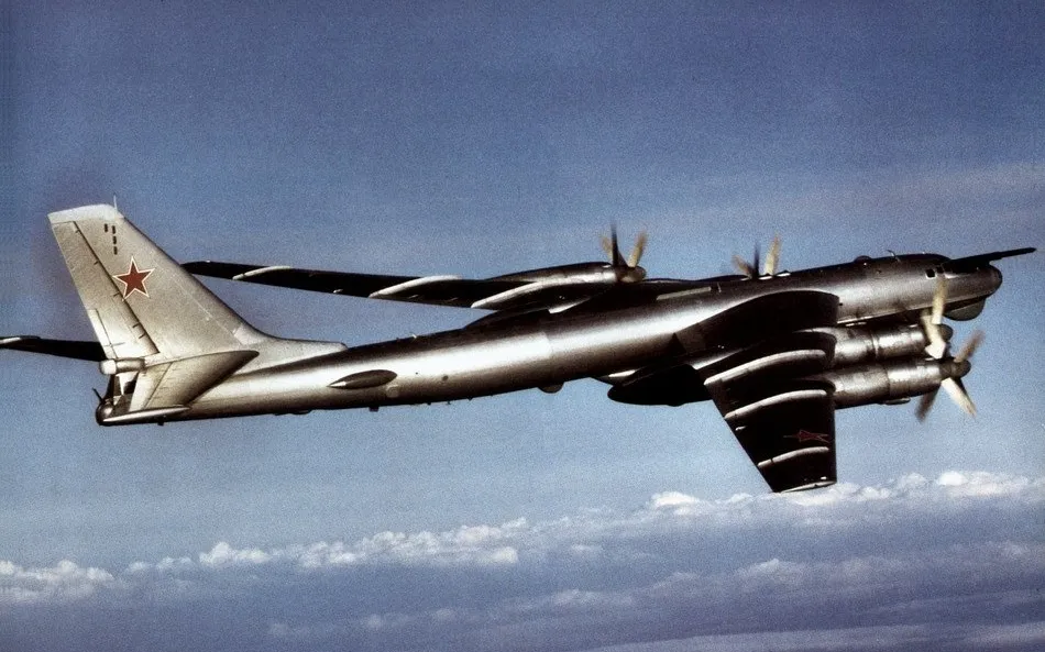 A Soviet Tupolev Tu-95 strategic bomber, NATO reporting name Bear, seen from the side in flight in 1984.